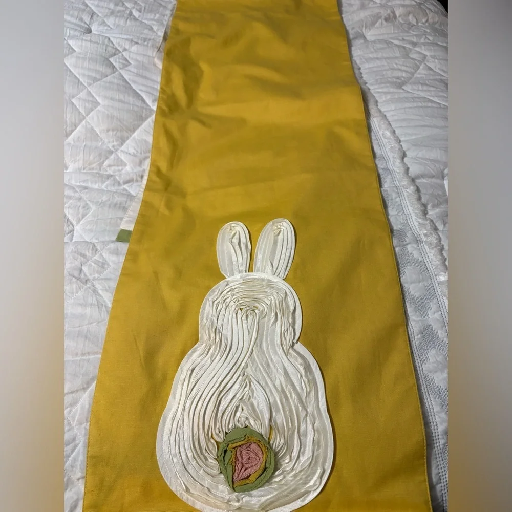 Cute bunny table runner by Pier 1 Imports. Golden yellow with cream bunnies.